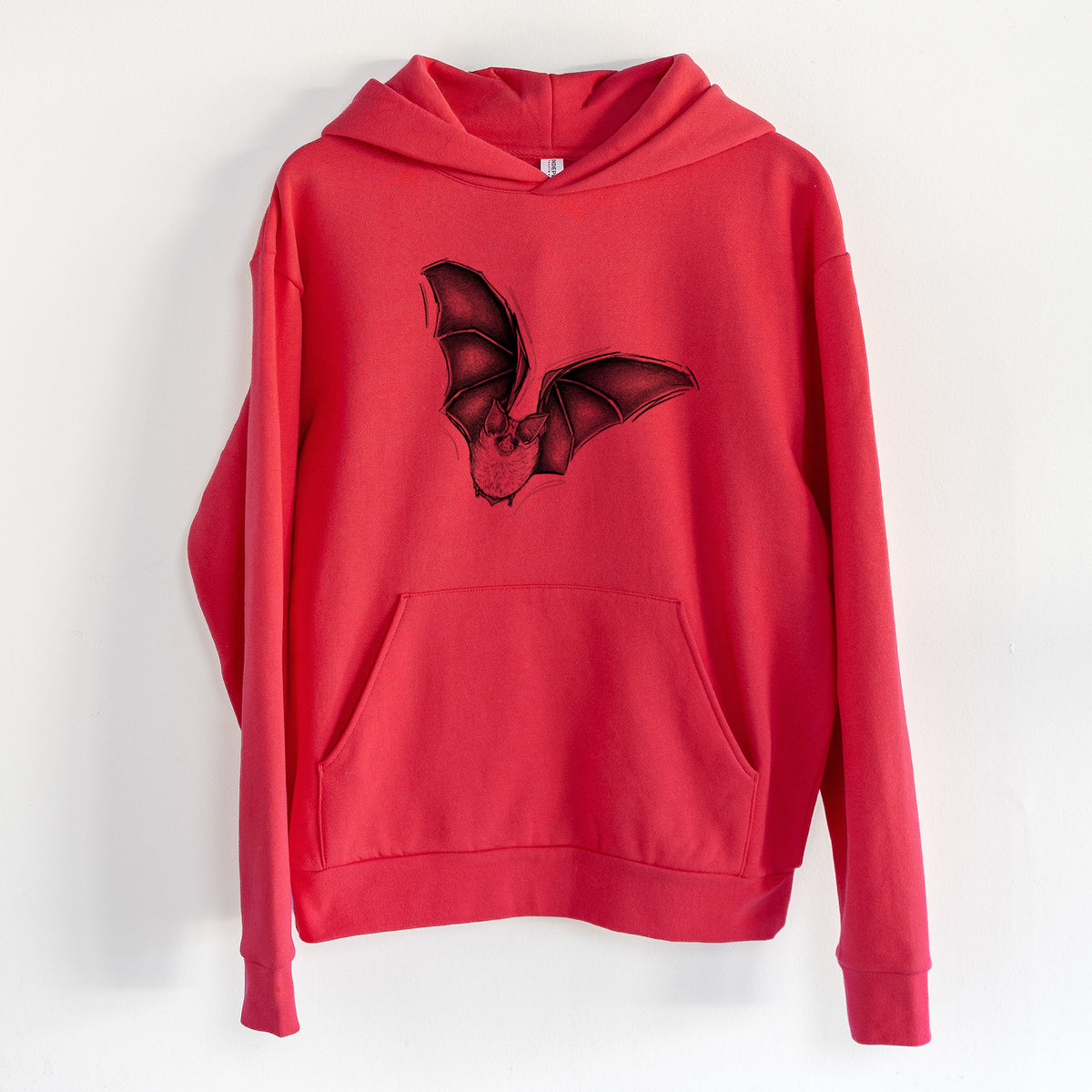 Macrotus californicus - California Leaf-nosed Bat - Statement Midweight Hoodie in Cherry Red, hanging on a white wall, with a front kangaroo pocket and no drawcords.