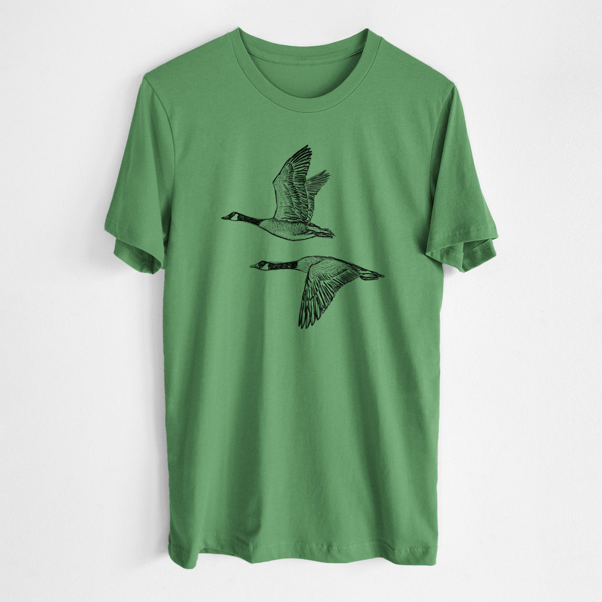 Canada Geese in Flight - Branta canadensis - Lightweight 100% Cotton Unisex Crewneck in Leaf Green, worn by model