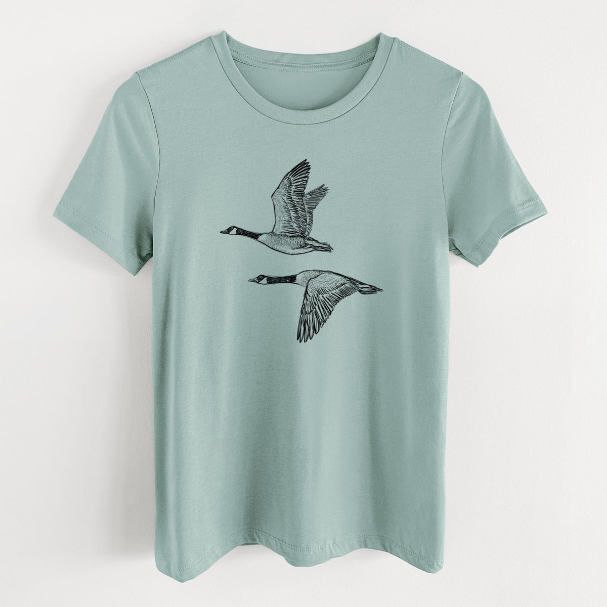 Canada Geese in Flight - Branta canadensis - Women's Lightweight Relaxed Fit 100% Cotton Crewneck in Dusty Blue, on a hanger