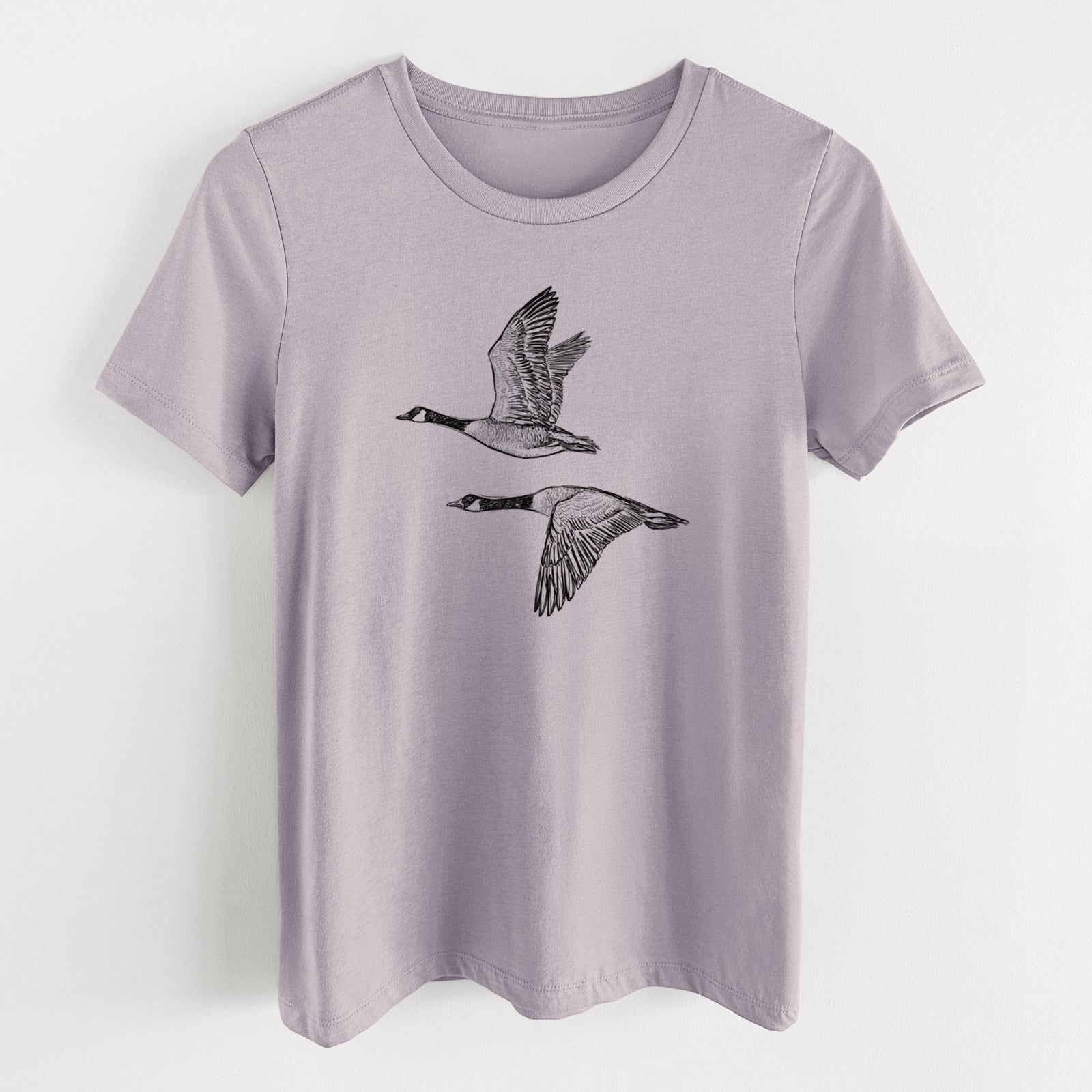 Canada Geese in Flight - Branta canadensis - Women's Lightweight Relaxed Fit 100% Cotton Crewneck in Light Violet, on a hanger