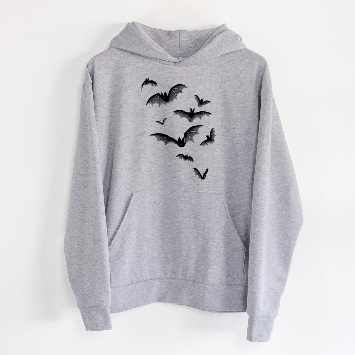 Cloud of Bats - Statement Midweight Hoodie in Heather Grey, hanging on a white wall, with a front kangaroo pocket and no drawcords.