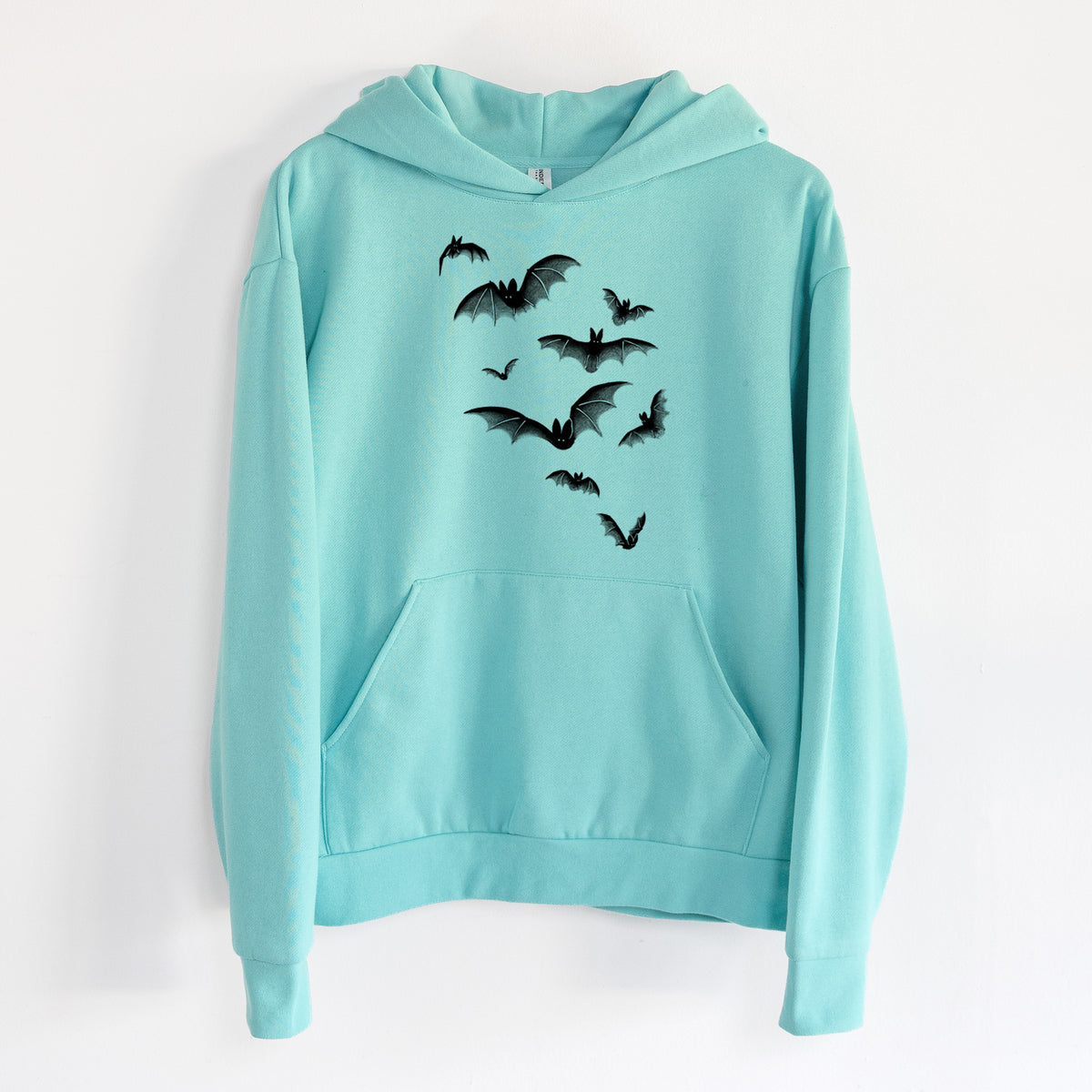 Cloud of Bats - Statement Midweight Hoodie in Seafoam, hanging on a white wall, with a front kangaroo pocket and no drawcords.