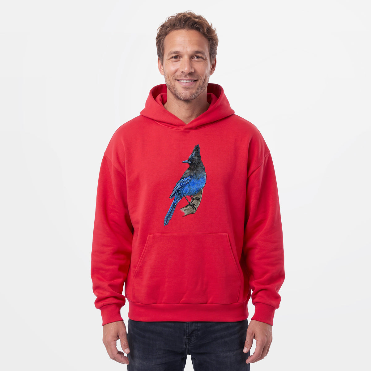 Male model wearing the Vibrant Coastal Steller's Jay - Cyanocitta stelleri - Statement Midweight Hoodie.
