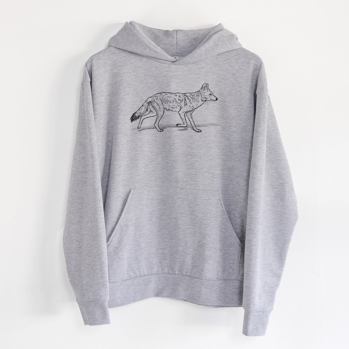 Coyote - Canis latrans - Statement Midweight Hoodie in Heather Grey, hanging on a white wall, with a front kangaroo pocket and no drawcords.