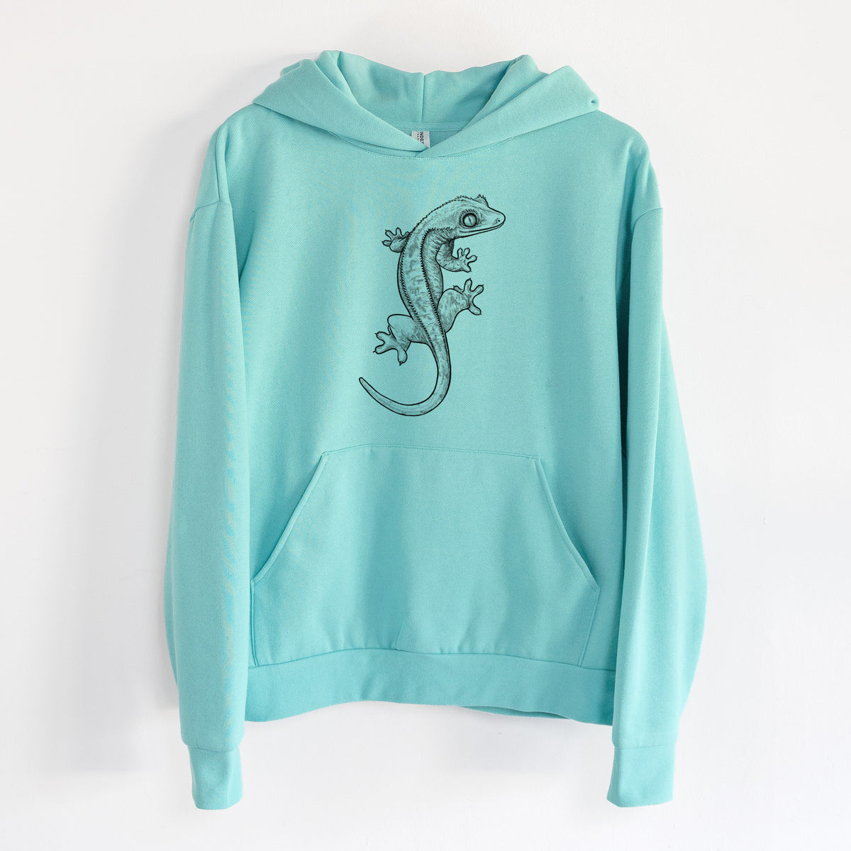 Crested Gecko - Correlophus ciliatus - Statement Midweight Hoodie in Seafoam, hanging on a white wall, with a front kangaroo pocket and no drawcords.