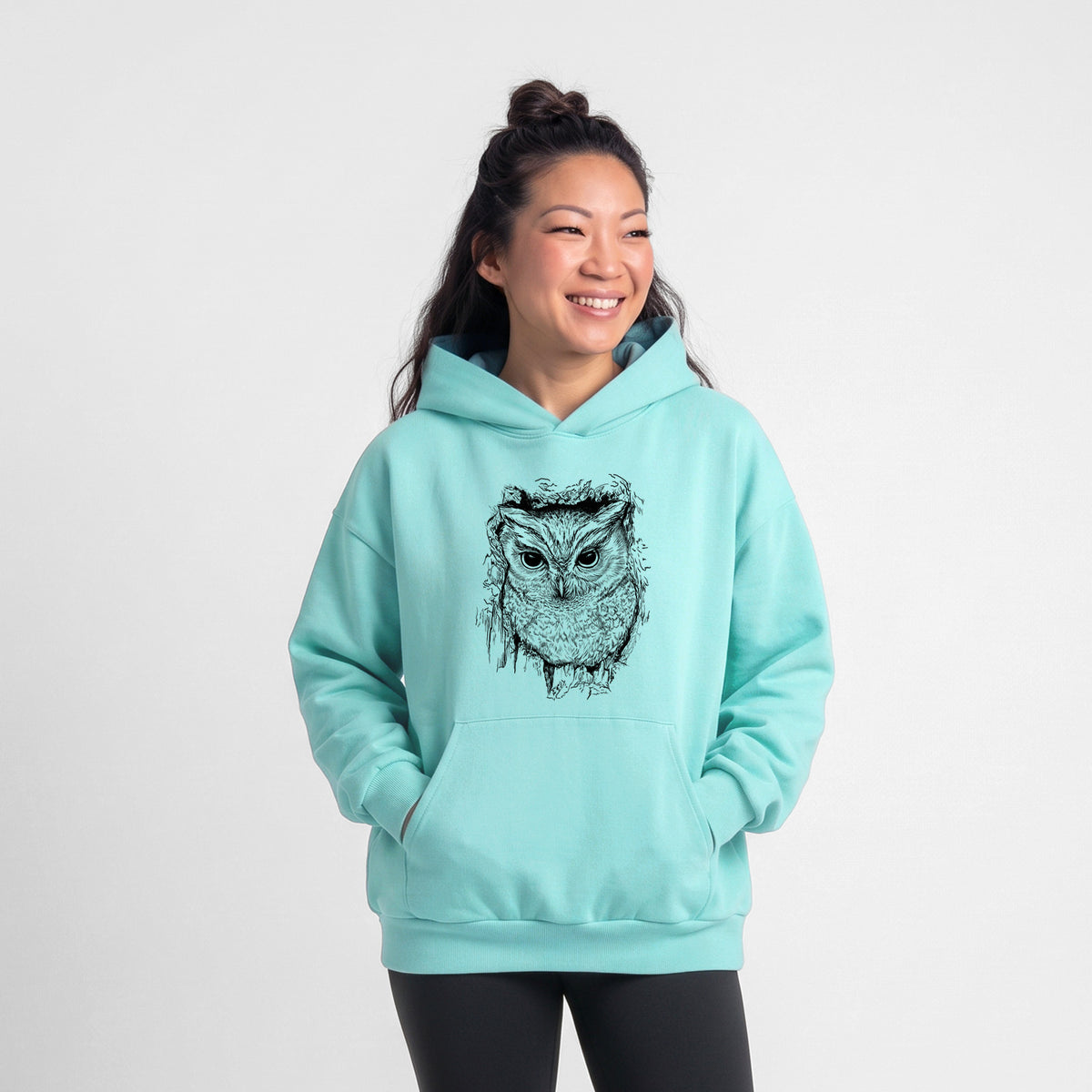 Female model wearing the Eastern Screech Owl - Megascops asio - Statement Midweight Hoodie.