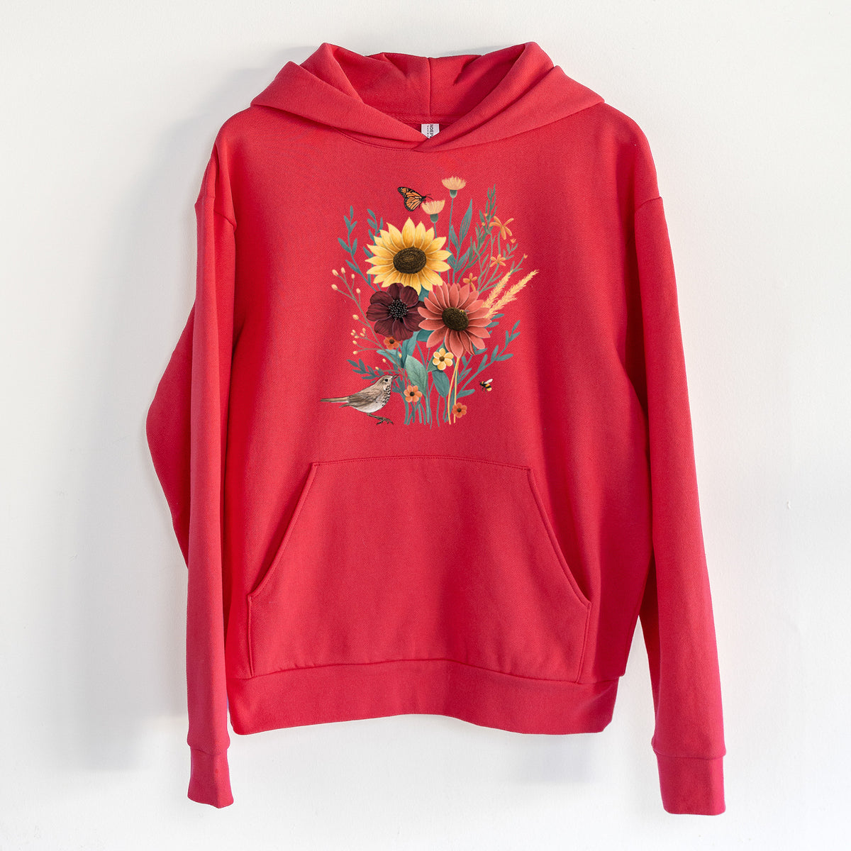 Fall Bouquet - Statement Midweight Hoodie in Cherry Red, hanging on a white wall, with a front kangaroo pocket and no drawcords.