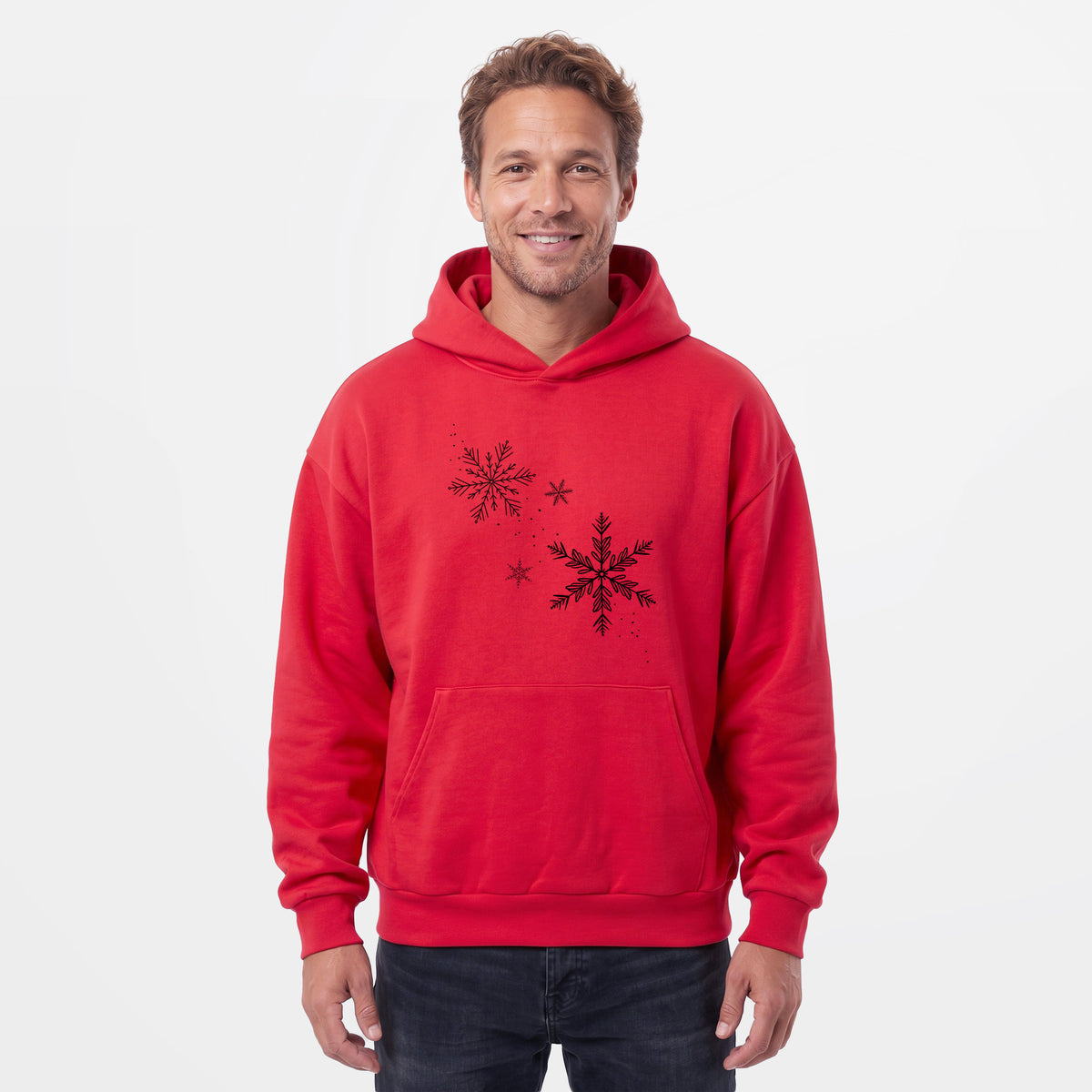 Male model wearing the Falling Snowflakes - Statement Midweight Hoodie.