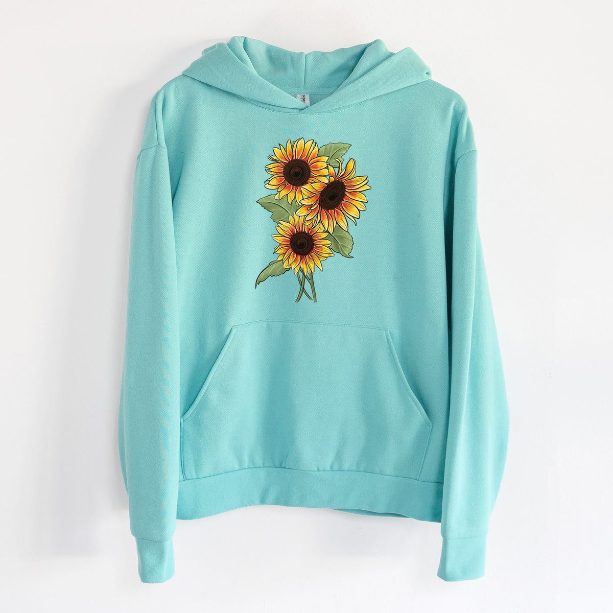 Firecracker Sunflowers - Helianthus annuus - Statement Midweight Hoodie in Seafoam, hanging on a white wall, with a front kangaroo pocket and no drawcords.