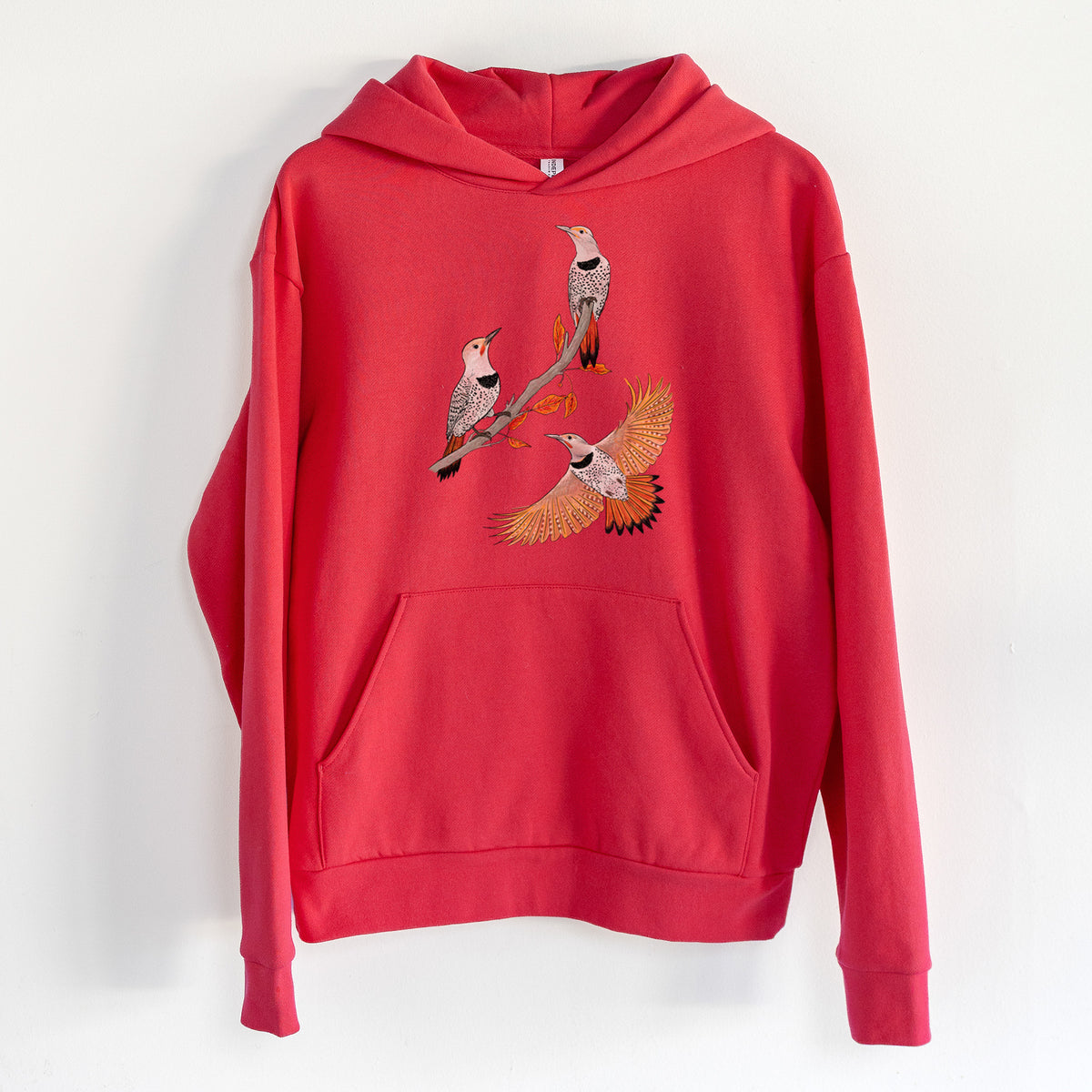 Northern Flickers (Red-shafted) - Colaptes auratus - Statement Midweight Hoodie in Cherry Red, hanging on a white wall, with a front kangaroo pocket and no drawcords.
