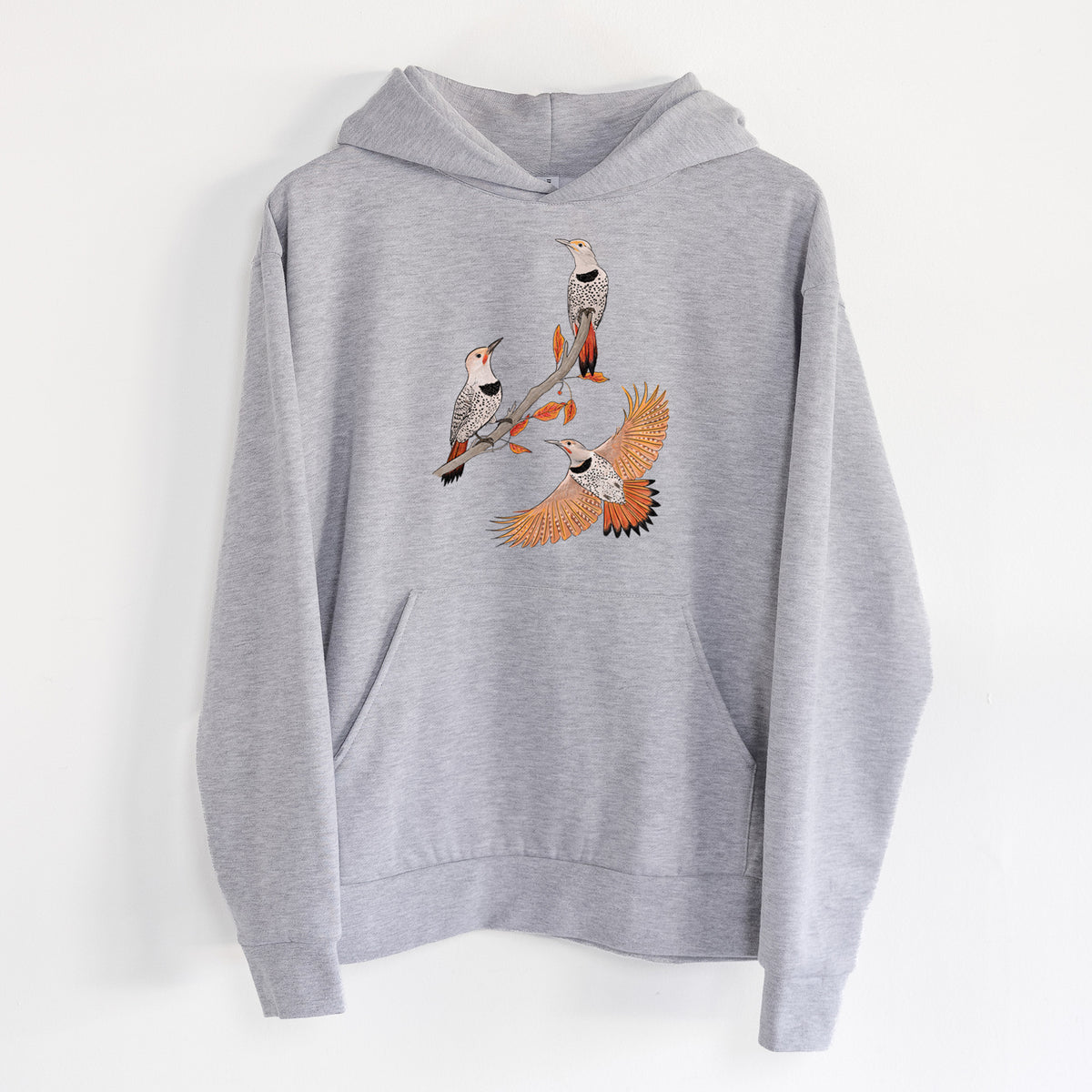 Northern Flickers (Red-shafted) - Colaptes auratus - Statement Midweight Hoodie in Heather Grey, hanging on a white wall, with a front kangaroo pocket and no drawcords.
