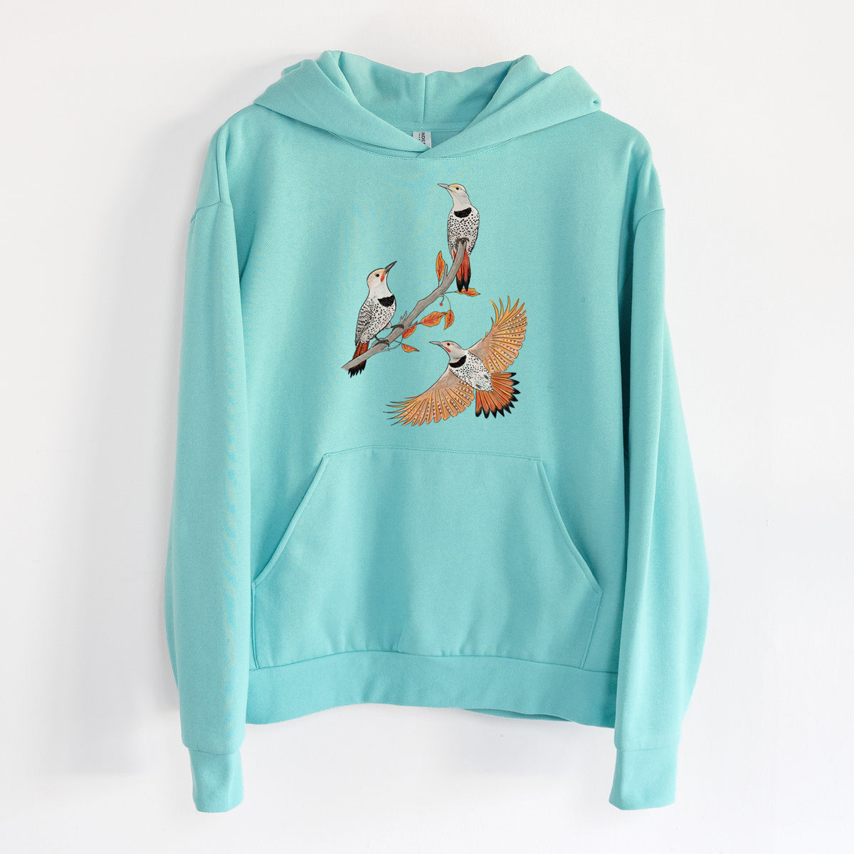 Northern Flickers (Red-shafted) - Colaptes auratus - Statement Midweight Hoodie in Seafoam, hanging on a white wall, with a front kangaroo pocket and no drawcords.