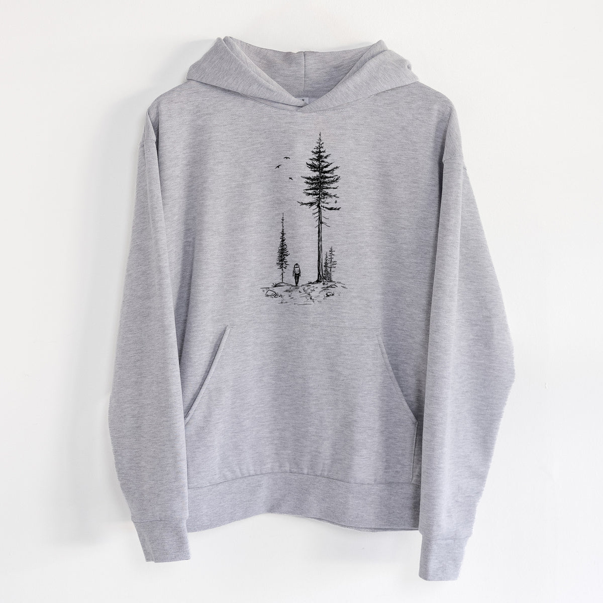 Forest Explorer - Statement Midweight Hoodie in Heather Grey, hanging on a white wall, with a front kangaroo pocket and no drawcords.