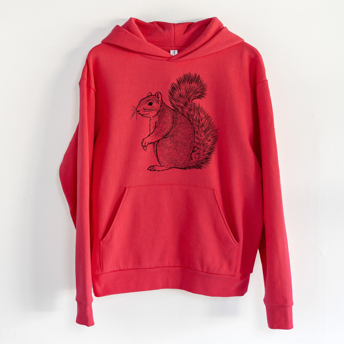 Eastern Fox Squirrel - Sciurus niger - Statement Midweight Hoodie in Cherry Red, hanging on a white wall, with a front kangaroo pocket and no drawcords.