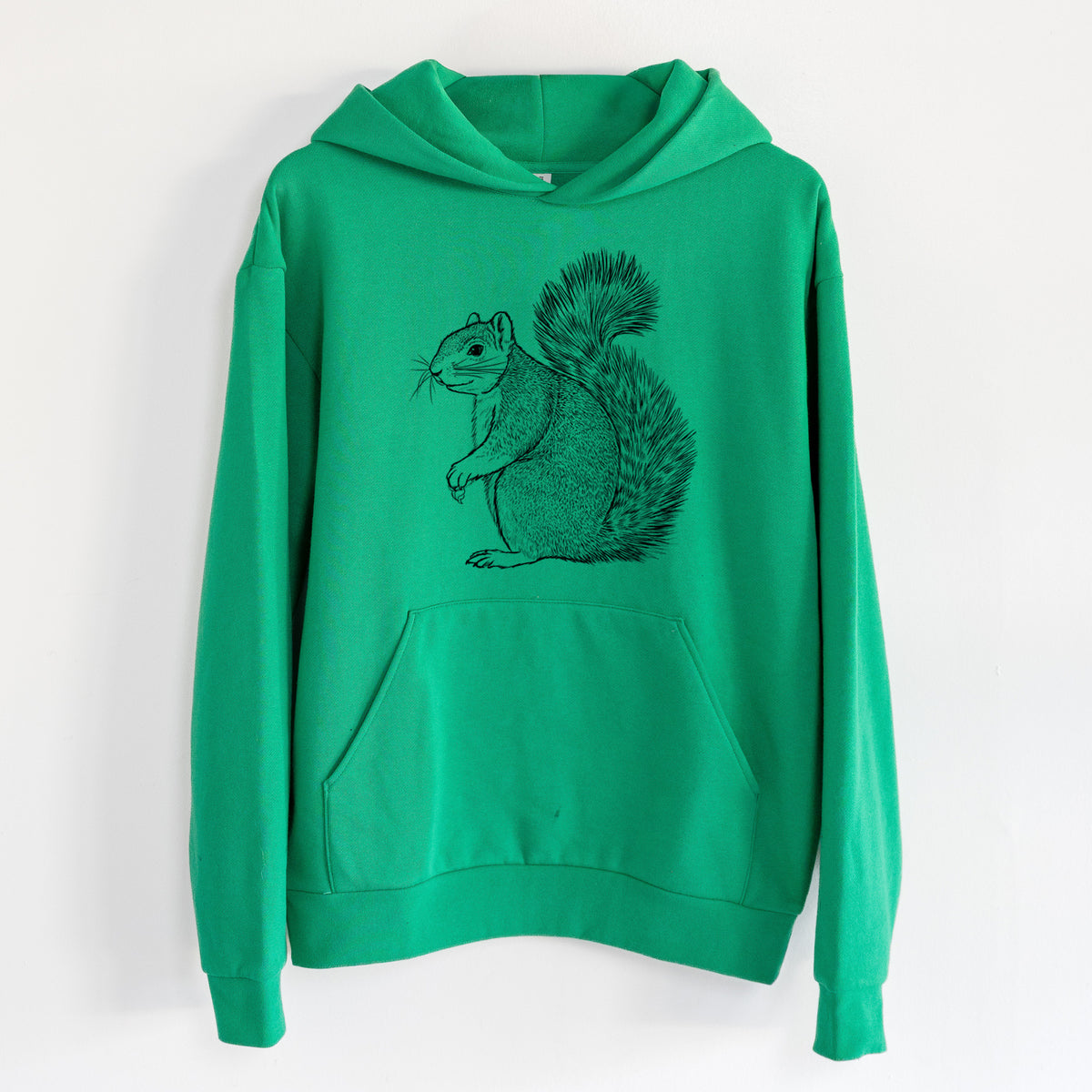 Eastern Fox Squirrel - Sciurus niger - Statement Midweight Hoodie in Kelly Green, hanging on a white wall, with a front kangaroo pocket and no drawcords.