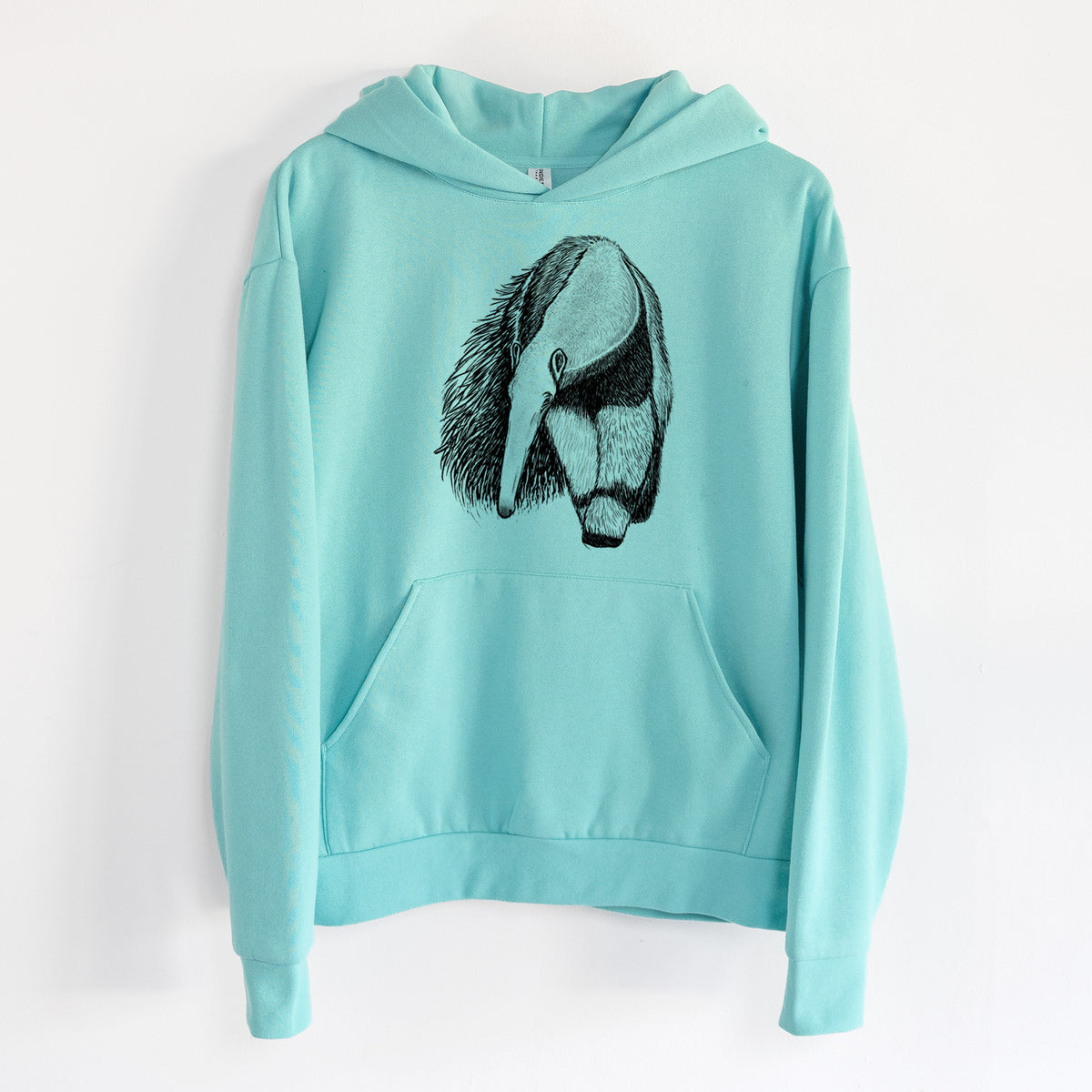 Giant Anteater - Myrmecophaga tridactyla - Statement Midweight Hoodie in Seafoam, hanging on a white wall, with a front kangaroo pocket and no drawcords.