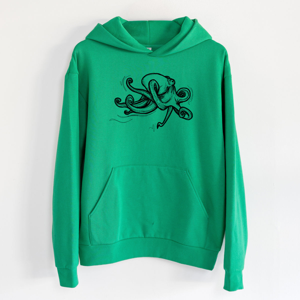 Giant Pacific Octopus - Statement Midweight Hoodie in Kelly Green, hanging on a white wall, with a front kangaroo pocket and no drawcords.