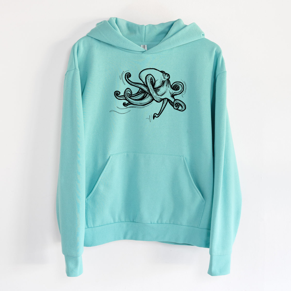 Giant Pacific Octopus - Statement Midweight Hoodie in Seafoam, hanging on a white wall, with a front kangaroo pocket and no drawcords.