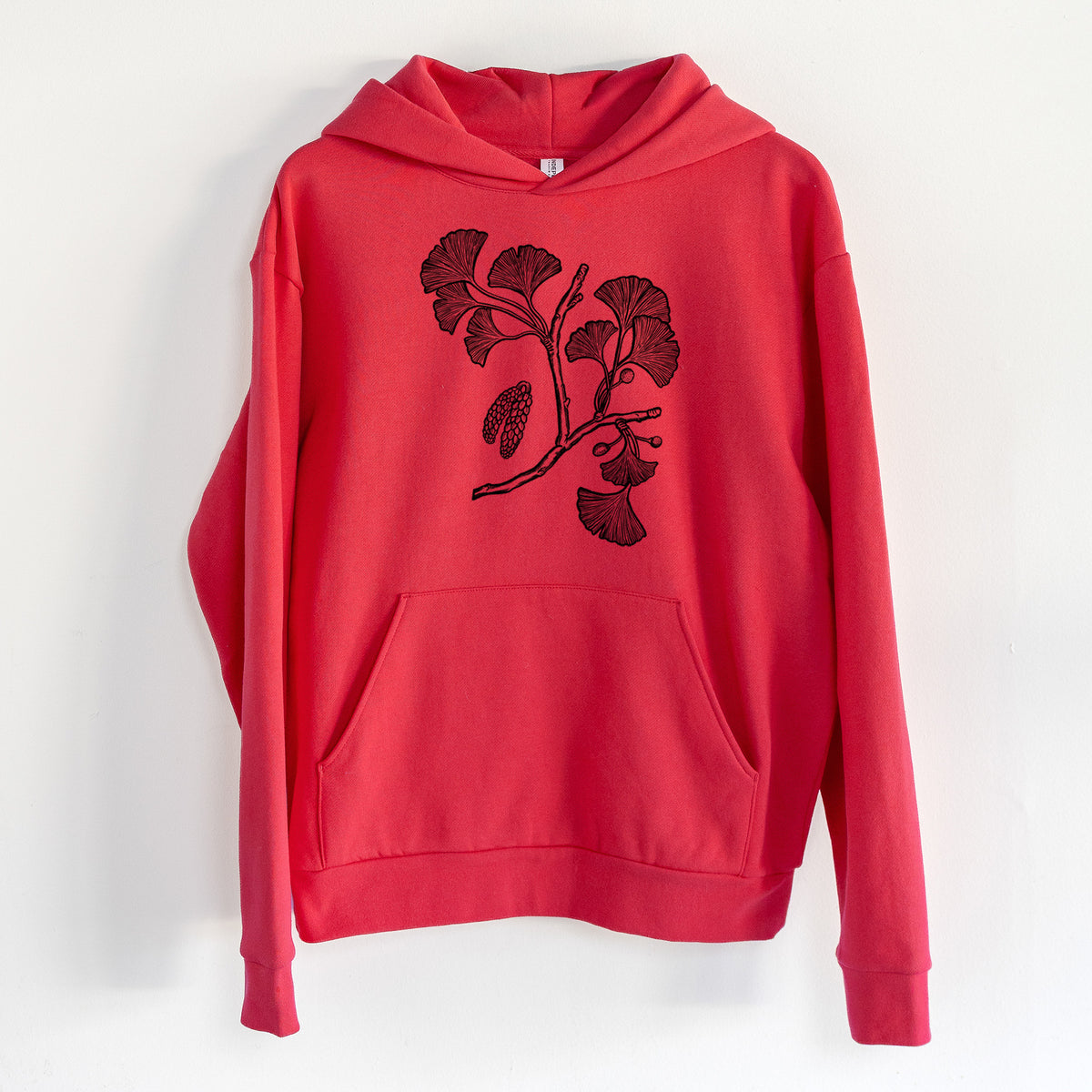 Ginkgo Biloba - Ginkgo Tree Stem with Leaves - Statement Midweight Hoodie in Cherry Red, hanging on a white wall, with a front kangaroo pocket and no drawcords.