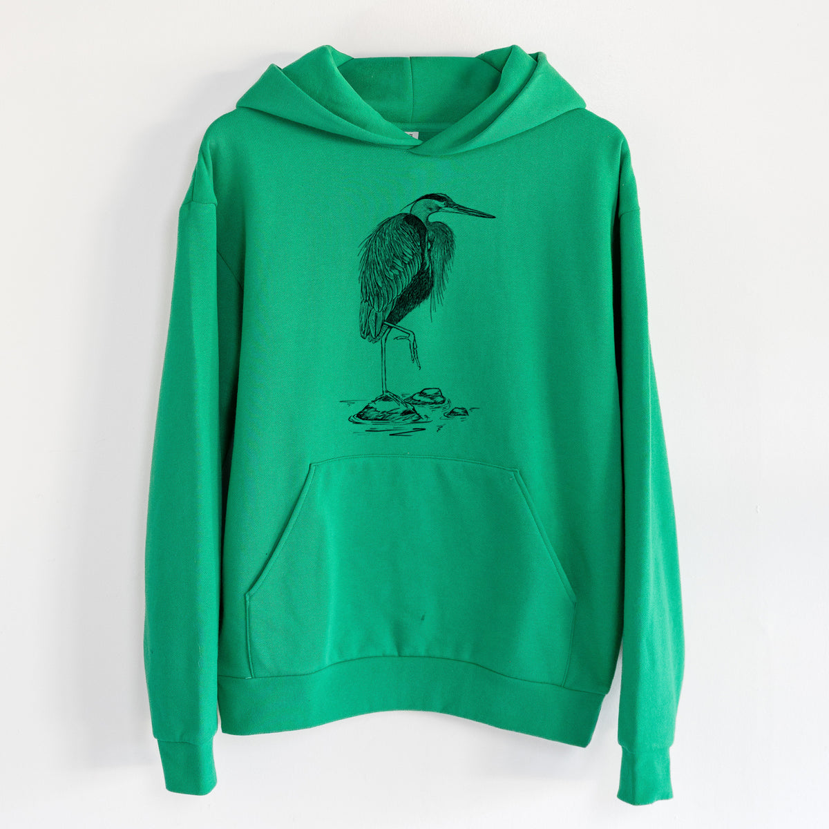Ardea herodias - Great Blue Heron - Statement Midweight Hoodie in Kelly Green, hanging on a white wall, with a front kangaroo pocket and no drawcords.