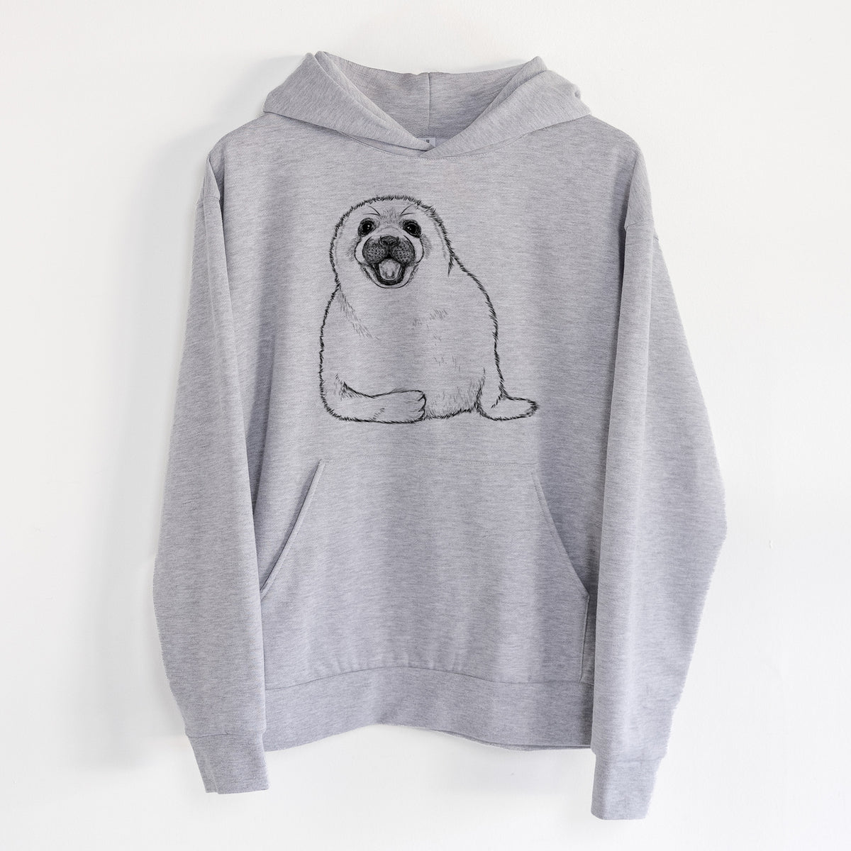 Harp Seal Pup - Pagophilus groenlandicus - Statement Midweight Hoodie in Heather Grey, hanging on a white wall, with a front kangaroo pocket and no drawcords.