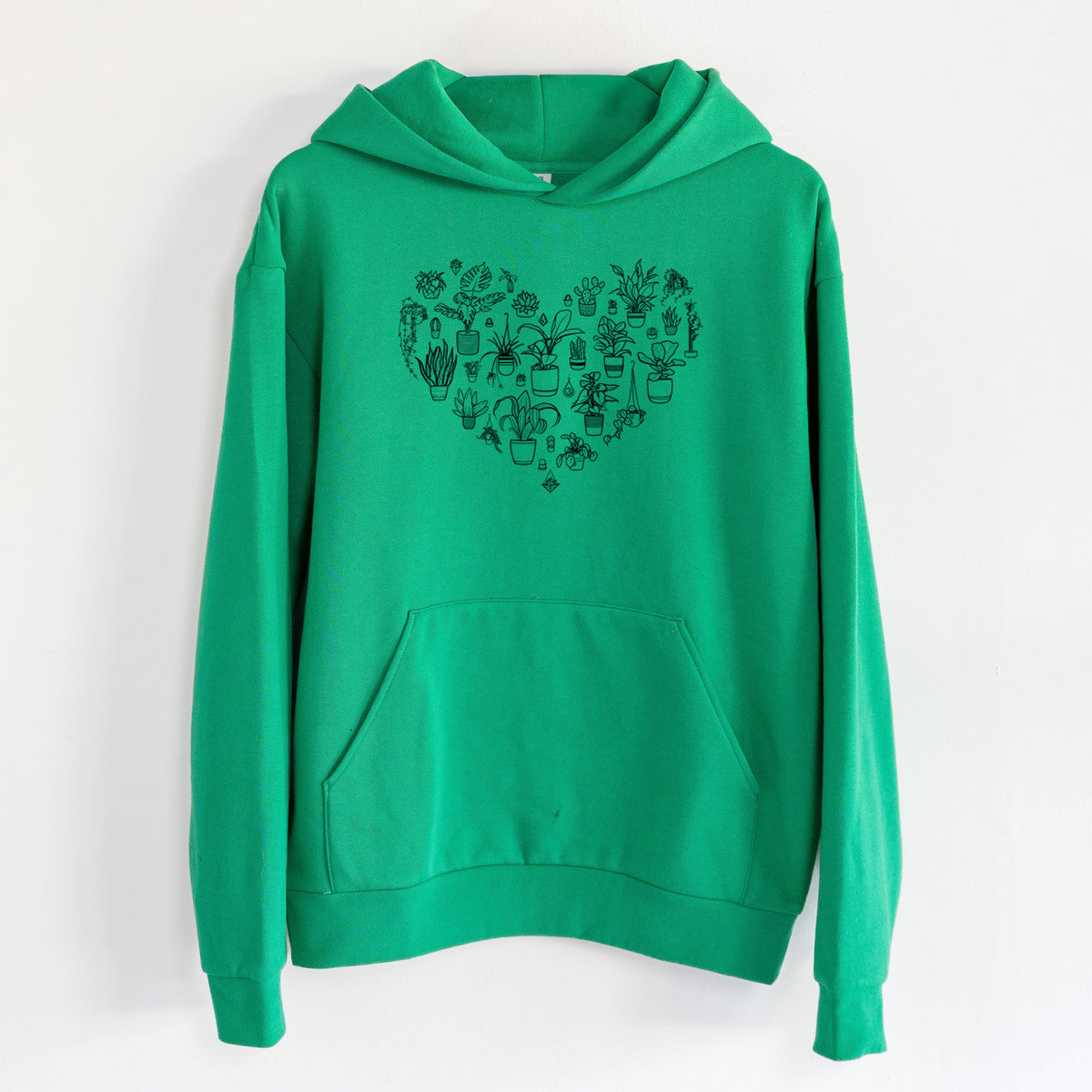 Heart Full of House Plants - Statement Midweight Hoodie in Kelly Green, hanging on a white wall, with a front kangaroo pocket and no drawcords.