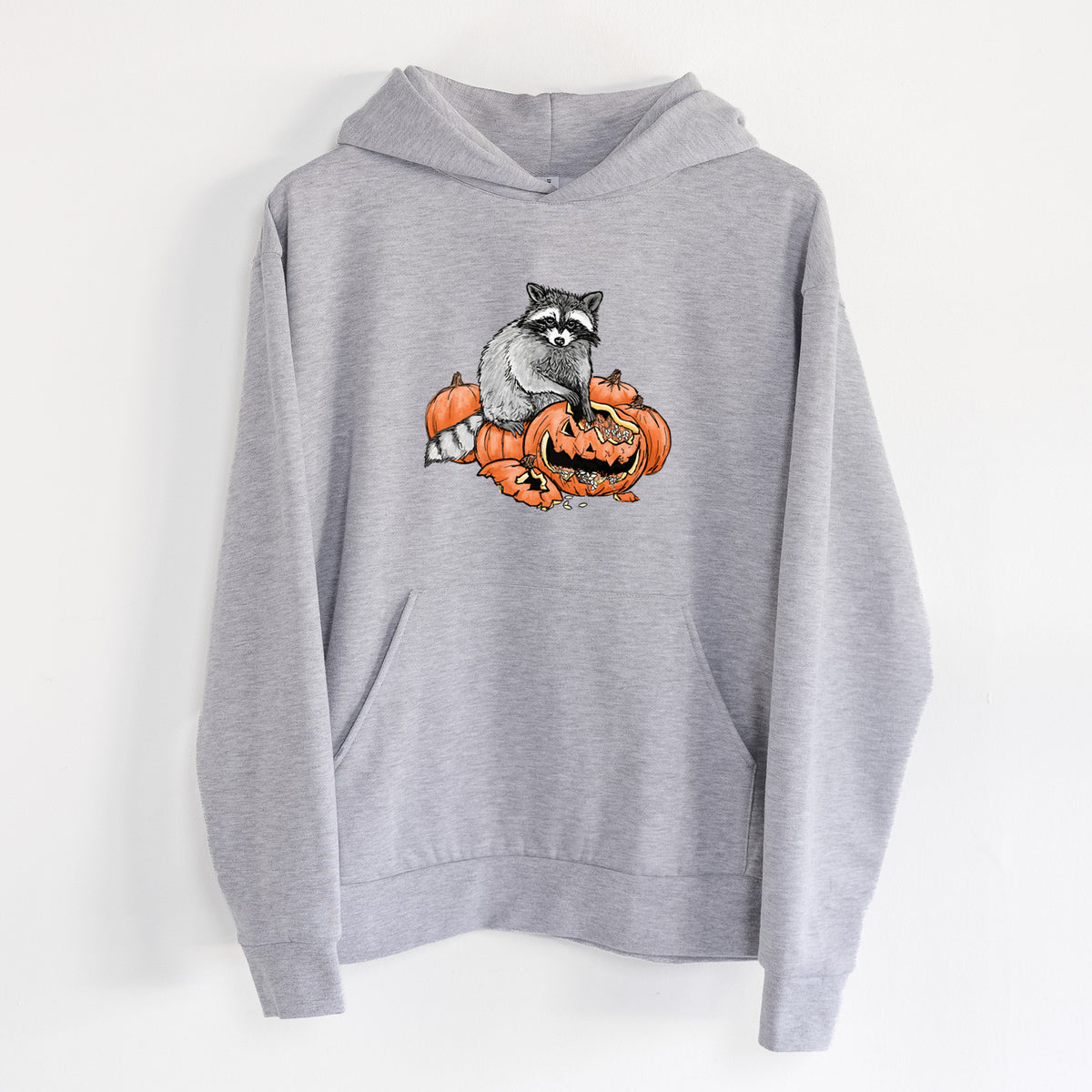 The Raccoon and the Jack-o'-Lantern - Statement Midweight Hoodie in Heather Grey, hanging on a white wall, with a front kangaroo pocket and no drawcords.