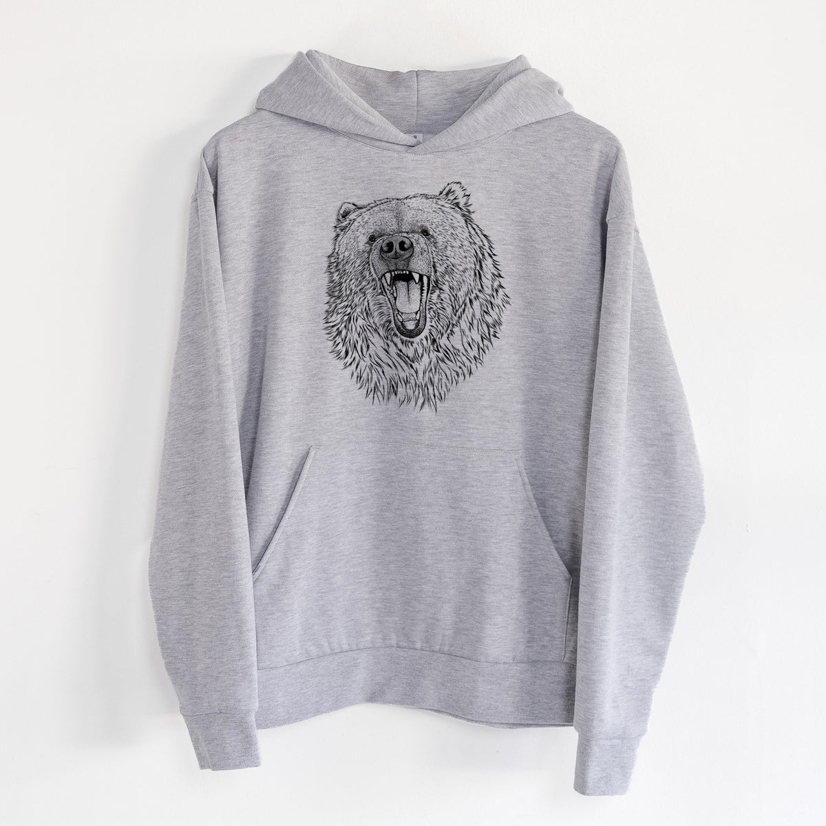 Ursus arctos - Kodiak Bear - Statement Midweight Hoodie in Heather Grey, hanging on a white wall, with a front kangaroo pocket and no drawcords.