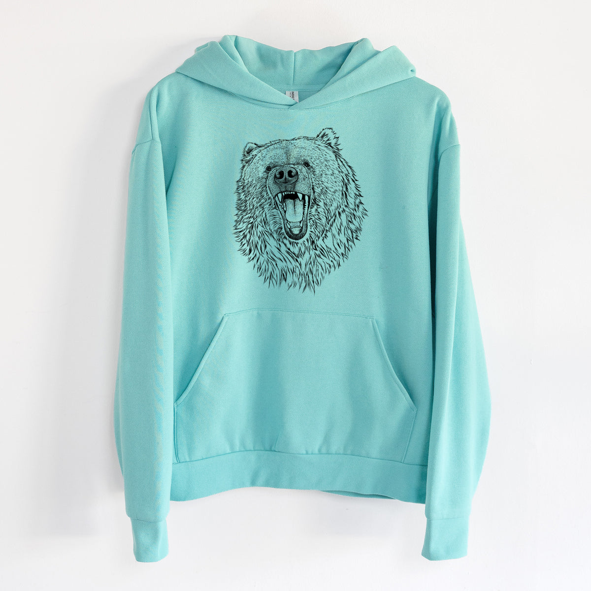 Ursus arctos - Kodiak Bear - Statement Midweight Hoodie in Seafoam, hanging on a white wall, with a front kangaroo pocket and no drawcords.