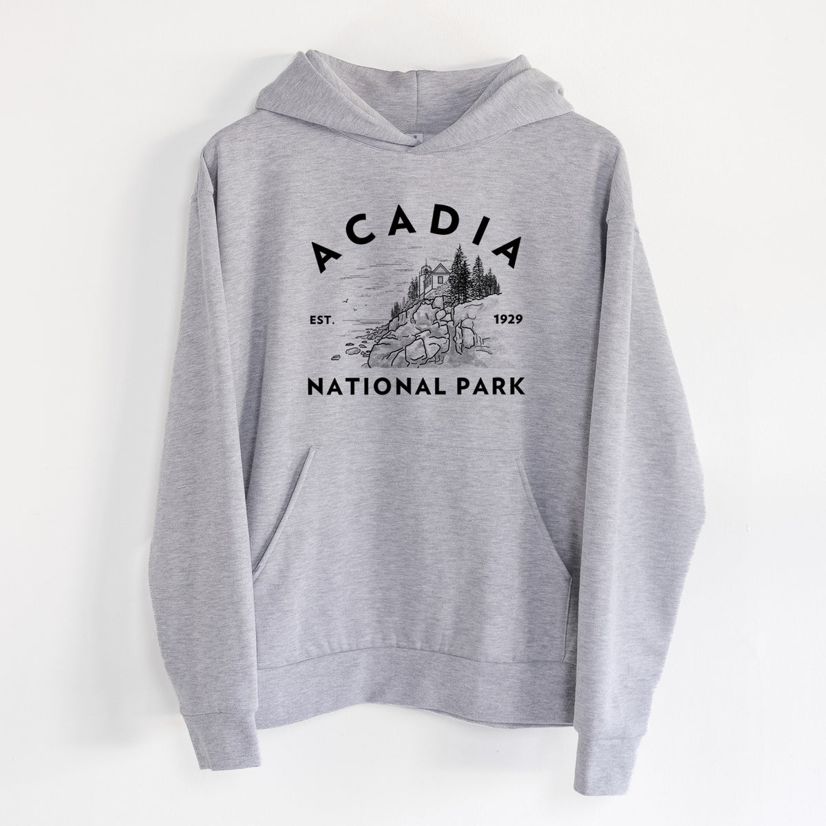 Acadia National Park - Statement Midweight Hoodie in Heather Grey, hanging on a white wall, with a front kangaroo pocket and no drawcords.