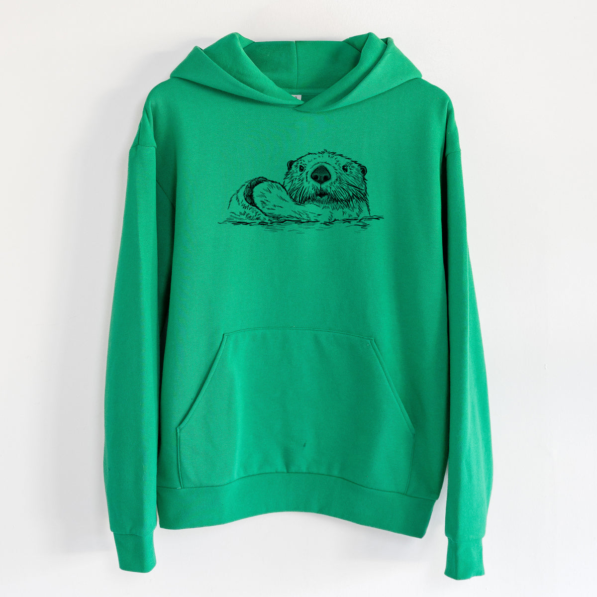 Northern Sea Otter - Enhydra lutris kenyoni - Statement Midweight Hoodie in Kelly Green, hanging on a white wall, with a front kangaroo pocket and no drawcords.