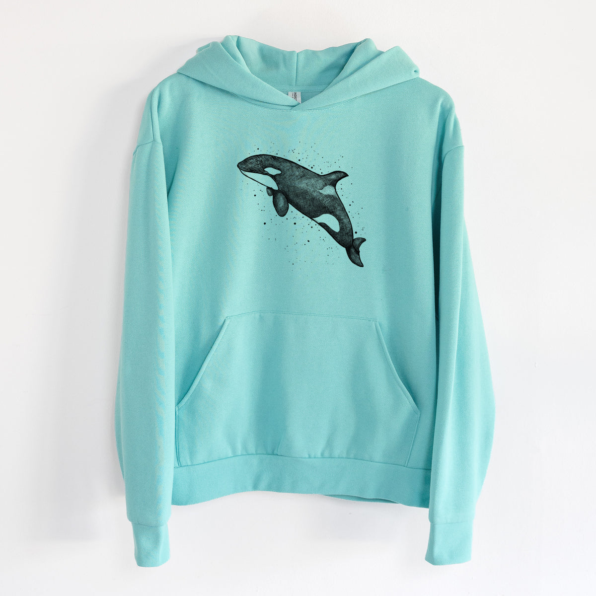 Orca Whale - Statement Midweight Hoodie in Seafoam, hanging on a white wall, with a front kangaroo pocket and no drawcords.