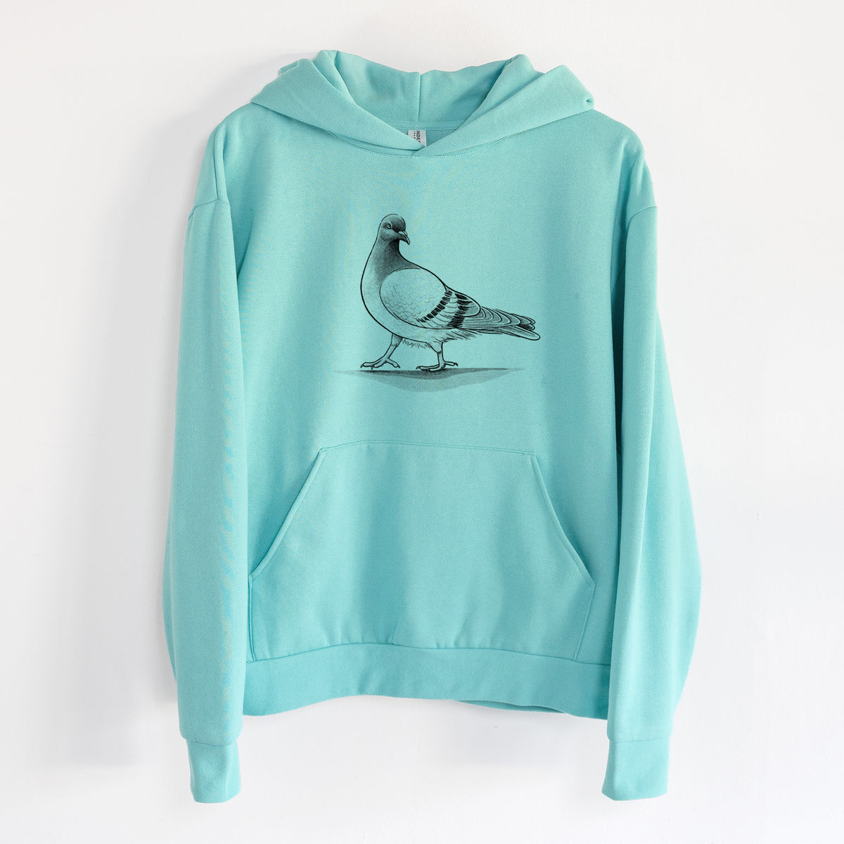 Pigeon / City Dove - Columba livia domestica - Statement Midweight Hoodie in Seafoam, hanging on a white wall, with a front kangaroo pocket and no drawcords.