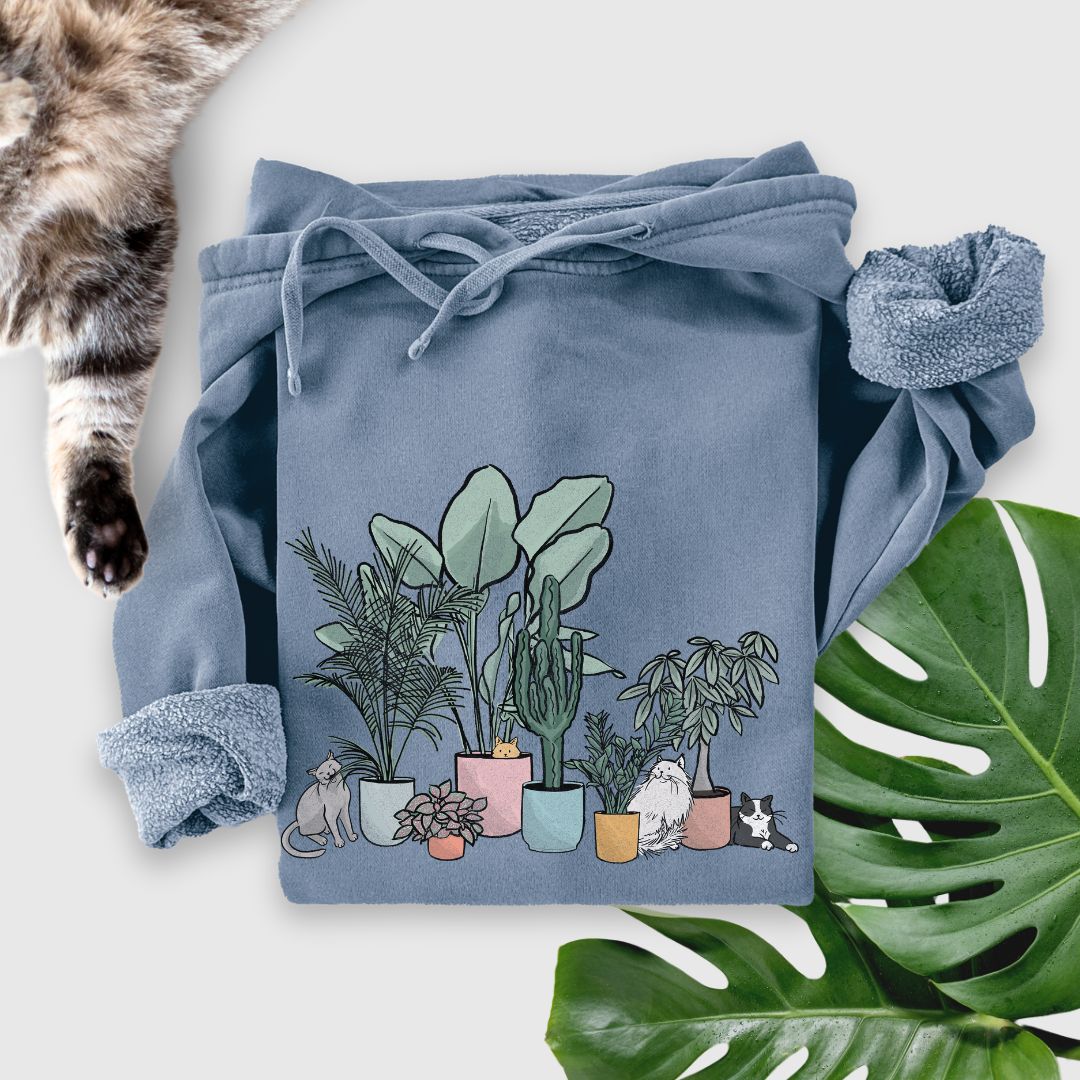 Super soft blue hoodie featuring a cute cats and plants design—aka the ultimate cozy uniform for plant parents and cat lover