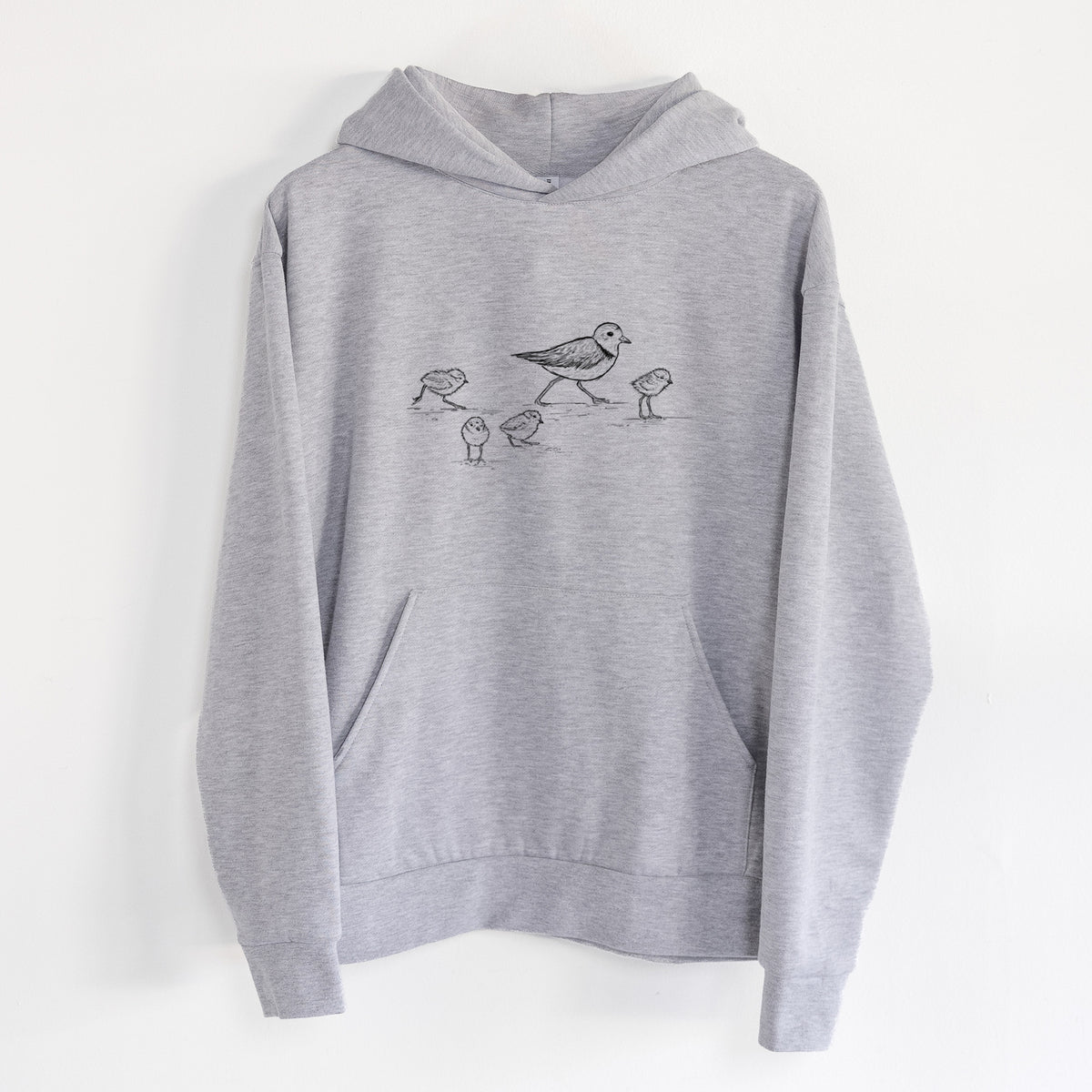 Piping Plovers - Charadrius melodus - Statement Midweight Hoodie in Heather Grey, hanging on a white wall, with a front kangaroo pocket and no drawcords.
