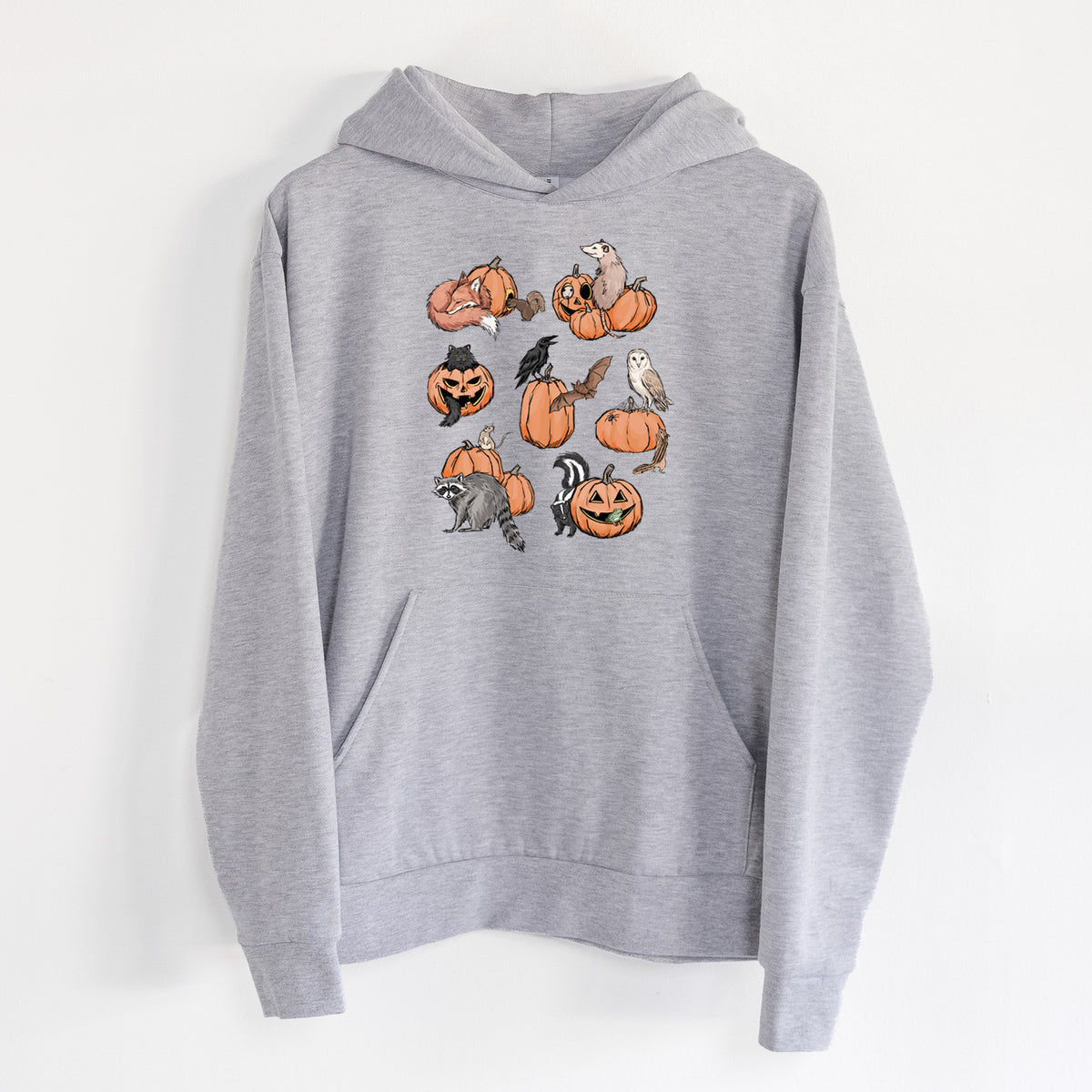 Woodland Pumpkin Patch Party - Statement Midweight Hoodie in Heather Grey, hanging on a white wall, with a front kangaroo pocket and no drawcords.
