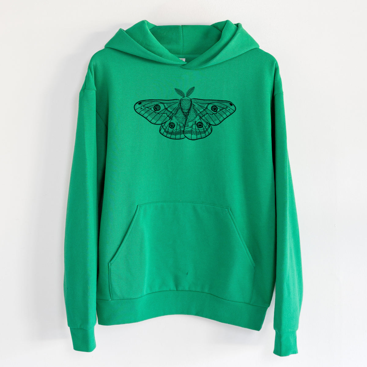 Saturnia pavonia - Small Emperor Moth - Statement Midweight Hoodie in Kelly Green, hanging on a white wall, with a front kangaroo pocket and no drawcords.