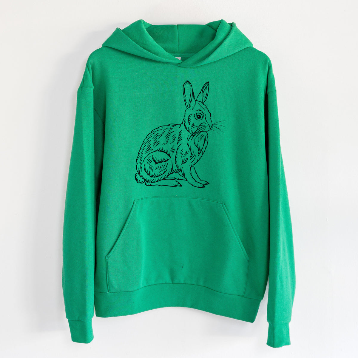 Snoeshoe Hare - Statement Midweight Hoodie in Kelly Green, hanging on a white wall, with a front kangaroo pocket and no drawcords.