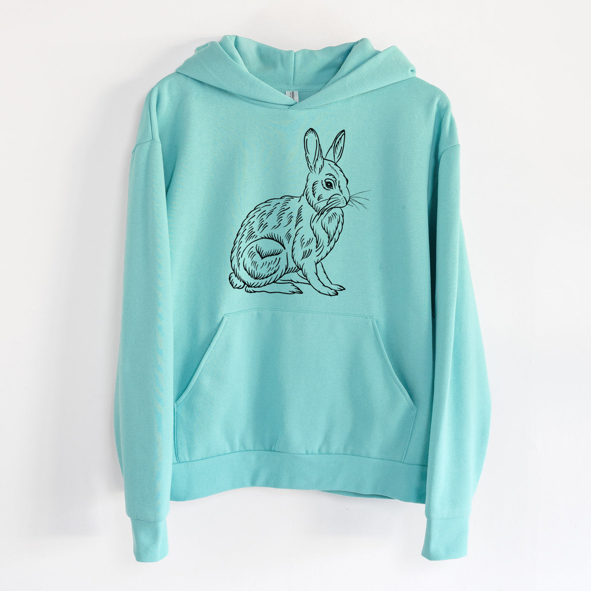 Snoeshoe Hare - Statement Midweight Hoodie in Seafoam, hanging on a white wall, with a front kangaroo pocket and no drawcords.