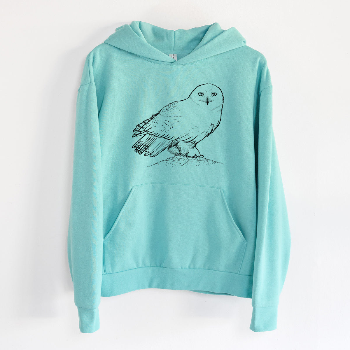 Snowy Owl - Bubo scandiacus - Statement Midweight Hoodie in Seafoam, hanging on a white wall, with a front kangaroo pocket and no drawcords.