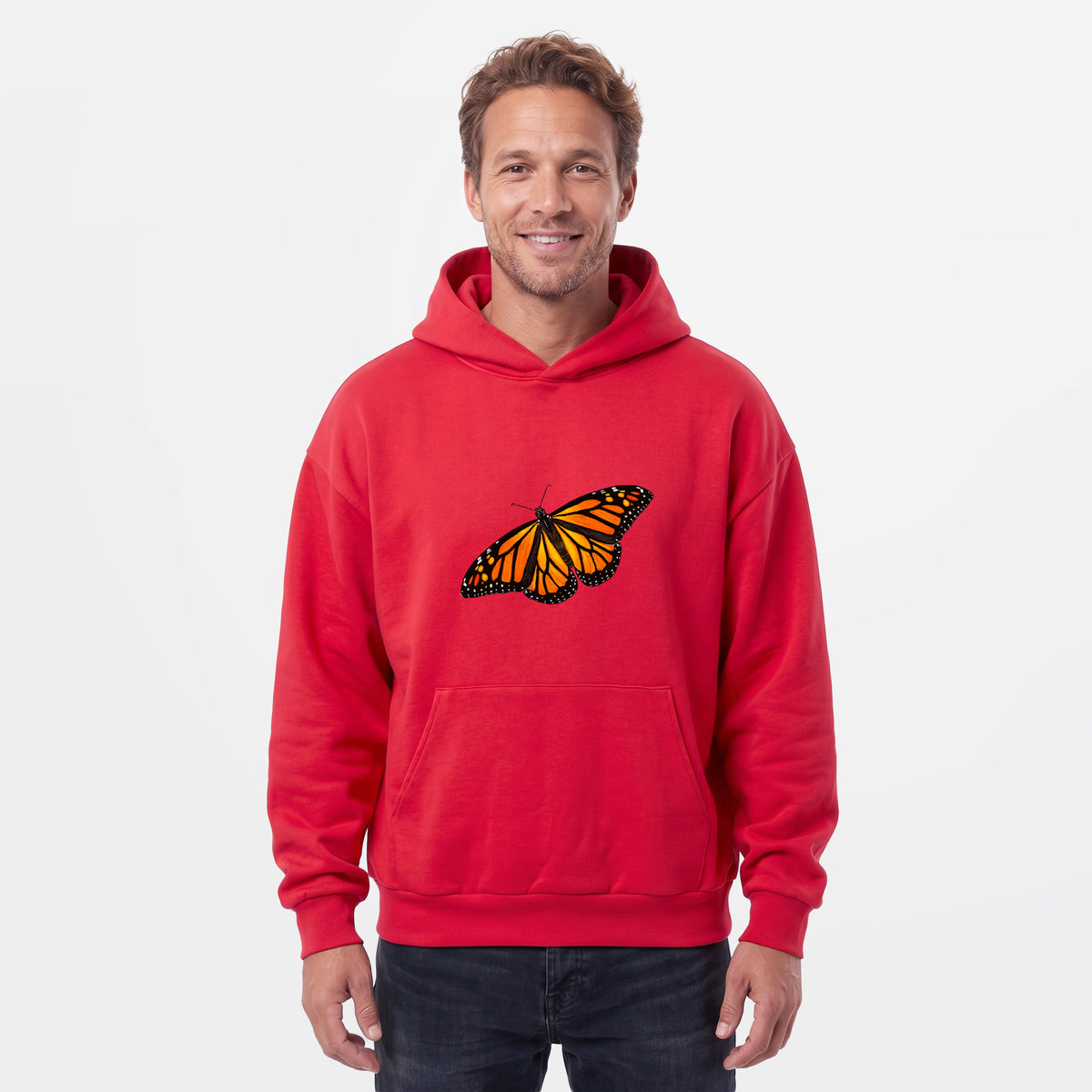 Male model wearing the Vibrant Monarch - Danaus plexippus - Statement Midweight Hoodie.