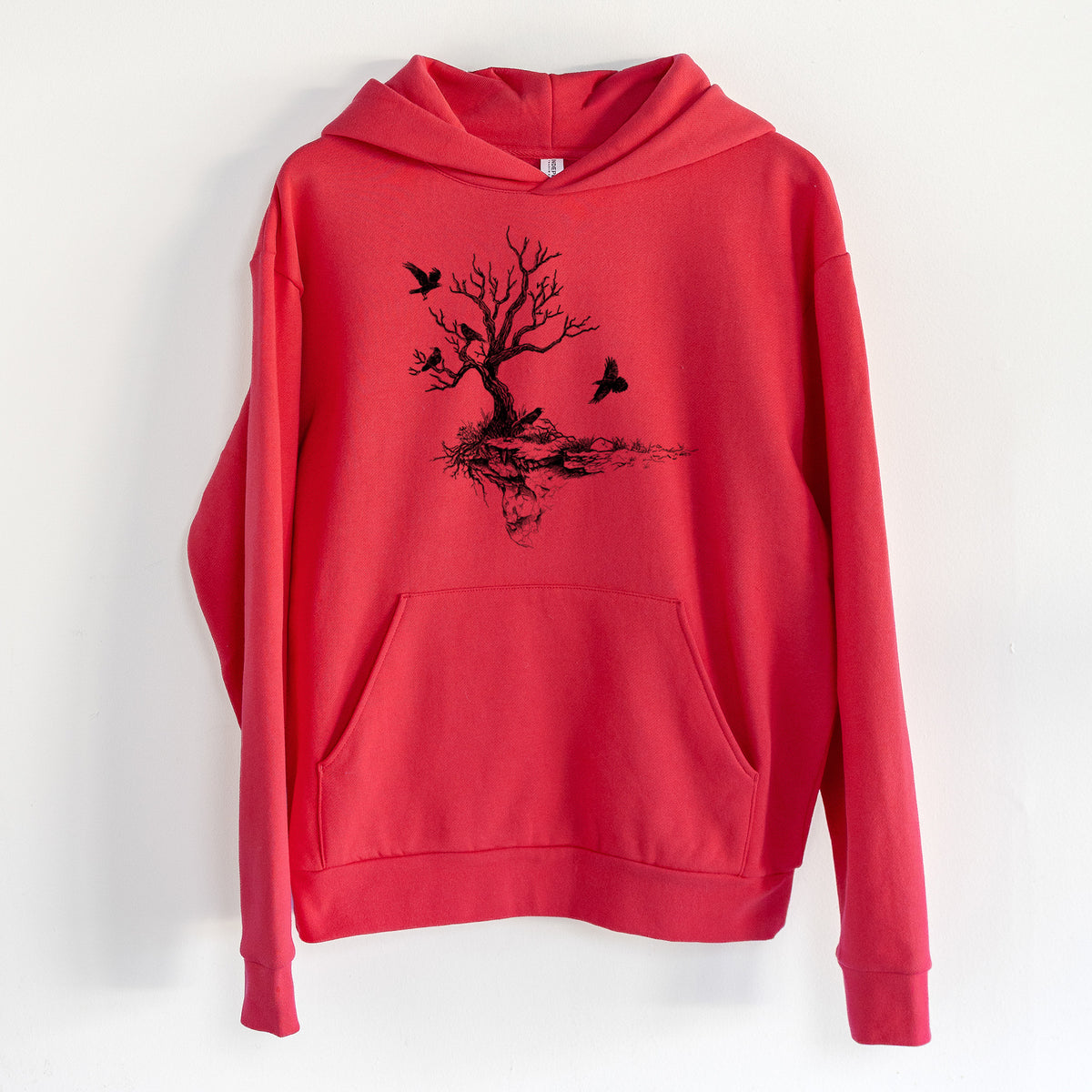 Twisted Tree with Ravens - Statement Midweight Hoodie in Cherry Red, hanging on a white wall, with a front kangaroo pocket and no drawcords.
