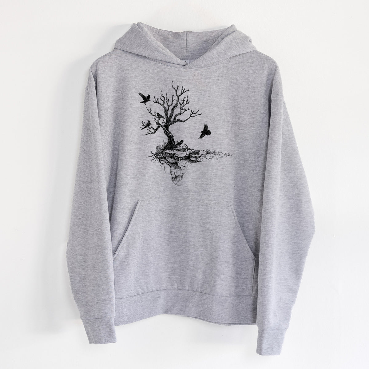Twisted Tree with Ravens - Statement Midweight Hoodie in Heather Grey, hanging on a white wall, with a front kangaroo pocket and no drawcords.