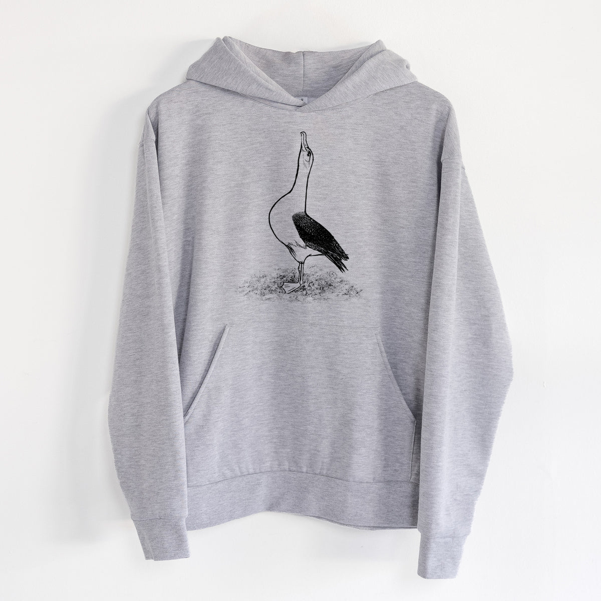Diomedea exulans - Wandering Albatross - Statement Midweight Hoodie in Heather Grey, hanging on a white wall, with a front kangaroo pocket and no drawcords.