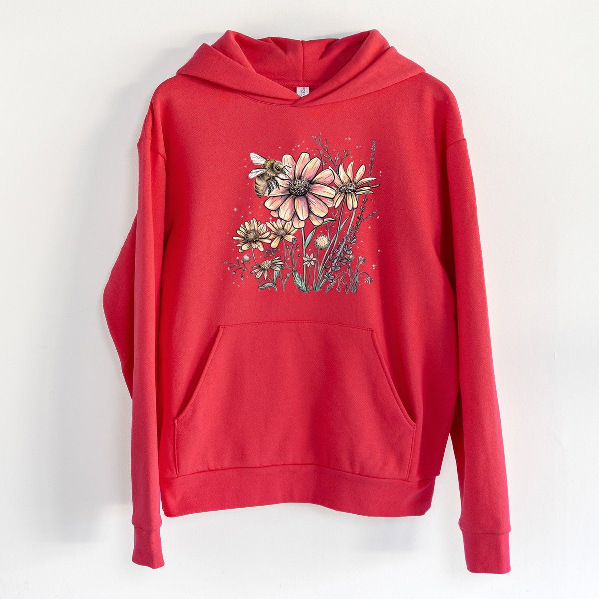 Bee with Wildflowers - Statement Midweight Hoodie in Cherry Red, hanging on a white wall, with a front kangaroo pocket and no drawcords.