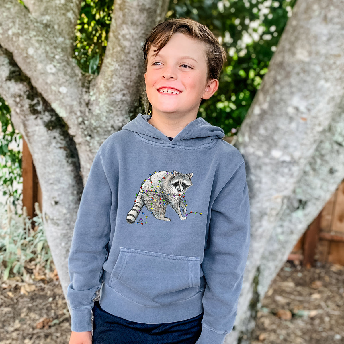 Christmas Raccoon - Youth Pigment Dyed Hoodie, worn by model