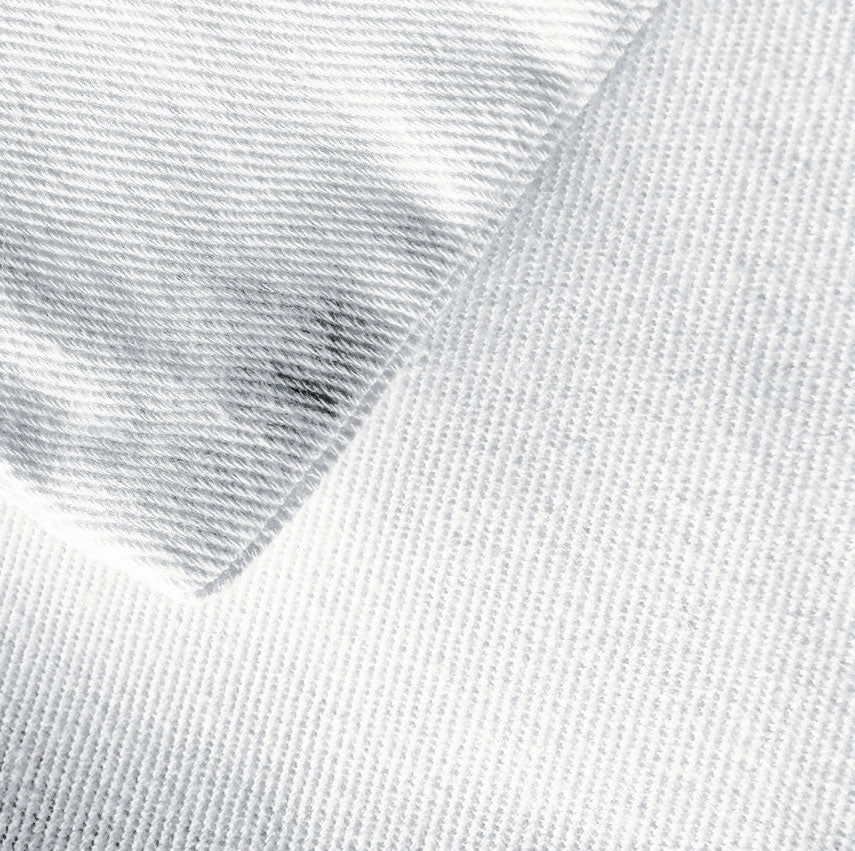 Close-up of textured white fabric with a slight sheen